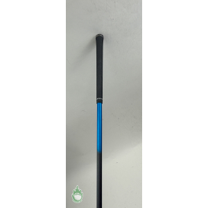 Black Golf Pride grip on a blue and black graphite golf club shaft against a light background.