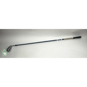 Titleist T200 3 driving iron with blue graphite shaft and patterned black grip lying on a white surface.