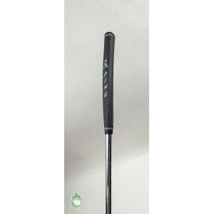 Black PING golf club grip with white lettering and slight wear on the sides.